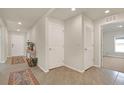 Spacious hallway with ceramic tile, recessed lighting, and multiple doorways adding functional space at 4004 Autumn Amber Dr, Spring Hill, FL 34609