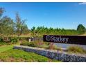 Starkey Ranch community entrance sign featuring lush greenery and landscaping at 4012 Dragonfly Trl, Odessa, FL 33556