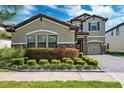 Charming two-story home with a three-car garage and a meticulously manicured front yard at 4012 Dragonfly Trl, Odessa, FL 33556