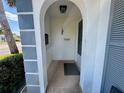 Covered entrance provides shelter and charm, complete with a mailbox and neutral tile flooring at 4235 Sheldon Pl # 4235, New Port Richey, FL 34652
