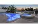Inviting pool and jacuzzi offer serene views, creating the perfect backyard oasis for relaxation and enjoyment at 4503 Jacona Dr, Hernando Beach, FL 34607