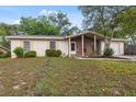 Inviting single-Gathering home with a brick facade and a neatly manicured front yard at 4559 Crescent Rd, Spring Hill, FL 34606