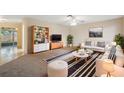 Bright living room featuring stylish furnishings and plenty of natural light at 4559 Crescent Rd, Spring Hill, FL 34606