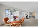 Dining area featuring a glass top table and a beautiful water view at 4632 Marine Pkwy # 201, New Port Richey, FL 34652