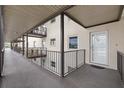 Exterior walkway showing the entrance to the unit with metal railings at 4632 Marine Pkwy # 201, New Port Richey, FL 34652