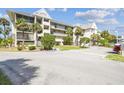 Attractive condo building exterior with balconies and greenery, illustrating a pleasant coastal residence at 5537 Sea Forest Dr # 301, New Port Richey, FL 34652