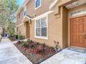 The house offers a meticulously maintained exterior and garden with direct sidewalk access at 6821 Breezy Palm Dr, Riverview, FL 33578