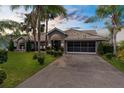 Charming home with mature landscaping, neutral paint, and a tile roof at sunset at 8200 Rhanbuoy Rd, Spring Hill, FL 34606