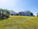 A nice home sitting on a well-manicured lot with mature landscaping at 13010 Siam Dr, Spring Hill, FL 34609