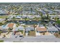 Expansive aerial view of a waterfront community with canals and well-maintained homes at 13700 Allyn Dr, Hudson, FL 34667