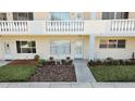 Inviting condo exterior features manicured landscaping, natural light and covered balcony at 2221 Swedish Dr # 15, Clearwater, FL 33763