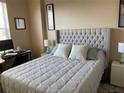 Comfortable bedroom with tufted headboard and coordinated decor at 700 S Harbour Island Blvd # 413, Tampa, FL 33602