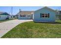 Inviting single-story home with well-maintained lawn and a concrete driveway leading to the front entrance at 3362 Minnow Creek Dr, Hernando Beach, FL 34607
