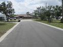 View of the surrounding neighborhood, showcasing nearby commercial businesses at 4520 Iris Dr, New Port Richey, FL 34652