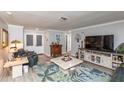 Comfortable living room with modern flooring and a view of the front porch at 4647 Gazebo Ct, New Port Richey, FL 34655