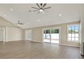 Spacious living room with a sliding glass door to the backyard, offering seamless indoor-outdoor living at 10423 Ashley Oaks Dr, Riverview, FL 33578