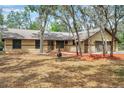 Charming single-story home with a three-car garage, set amongst mature trees and ample yard space at 10531 Lakeview Dr, New Port Richey, FL 34654