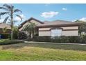 Inviting one-story home boasting lush landscaping, manicured hedges, and a serene suburban charm at 1641 Bayfield Ct, Trinity, FL 34655
