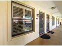 Exterior apartment hallway with window and entrances at 2410 Hammock Pine Blvd # 2410, Clearwater, FL 33761