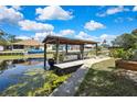 Private boat dock and canal access provide endless opportunities for waterfront living and recreation at 279 Maple Ave, Palm Harbor, FL 34684