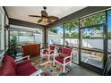 Relaxing screened patio with comfortable seating and a view of the backyard at 3515 Albritton St, New Port Richey, FL 34655