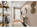 Charming entryway featuring modern decor, hardwood floors, and stylish accents at 4140 Passport Ln # 204, New Port Richey, FL 34653