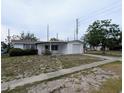 Charming single-story home with attached garage and a covered front porch at 5949 1St Ave, New Port Richey, FL 34652