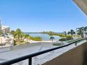 Expansive balcony with serene views of the bay and lush landscaping at 6035 Sea Ranch Dr # 209, Hudson, FL 34667