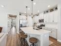 Bright, updated kitchen with white cabinetry, a central island with seating, and stainless steel appliances at 6229 Sea Air Dr, Apollo Beach, FL 33572