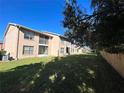 The backyard features a green space, partially shaded by trees, offers a relaxing environment at 6440 Spring Flower Dr # 14, New Port Richey, FL 34653
