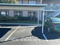 Assigned covered parking space, offering protection for your vehicle, conveniently located near building at 6440 Spring Flower Dr # 14, New Port Richey, FL 34653