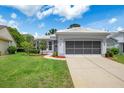 Charming single-story home with a well-maintained lawn and attractive landscaping at 9147 Rhett Ln, Weeki Wachee, FL 34613