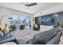 Comfortable living room with large windows and stylish furnishings with balcony at 920 N Osceola Ave # 203, Clearwater, FL 33755