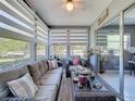 Relaxing sunroom with comfortable seating, large windows, and serene outdoor views at 12545 Dearborn Dr # D, Bayonet Point, FL 34667