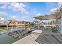 Waterfront home featuring a covered patio, and a dock for easy boat access at 13815 Plumosa Ave, Hudson, FL 34667