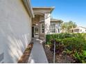Inviting front entrance with well maintained landscaping and a neutral color palette at 18109 Tiverton Ct, Hudson, FL 34667