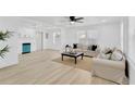 Bright living room with natural light, neutral tones and light wood flooring at 4035 Fairfield S Ave, St Petersburg, FL 33711
