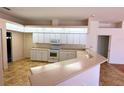 Bright kitchen with updated appliances and ample counter space for meal preparation at 4450 Anaconda Dr, New Port Richey, FL 34655