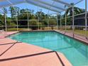 Sparkling screened-in pool for relaxing and enjoying the Florida sunshine at 4450 Anaconda Dr, New Port Richey, FL 34655