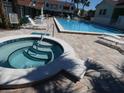 A luxurious community pool and spa provide residents with a relaxing oasis in a well-maintained neighborhood at 545 Walden Ct, Dunedin, FL 34698