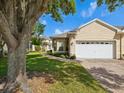 Charming single-story home with a well-maintained lawn and a two-car garage at 7427 Wimpole Dr # 7427, New Port Richey, FL 34655