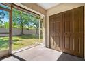 Outdoor view of screened-in back porch area, perfect for relaxing and enjoying the green backyard at 10780 43Rd N St # 702, Clearwater, FL 33762