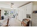 Bright, multi-purpose living space with built-ins and furniture at 11536 Golden Rain Dr, New Port Richey, FL 34654