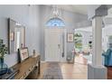 Bright foyer with decorative furnishings, a large window, and neutral-toned walls at 312 Barrington Ct, Spring Hill, FL 34609