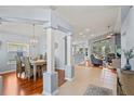 Open-concept living space with hardwood floors, dining area, and comfortable seating at 312 Barrington Ct, Spring Hill, FL 34609