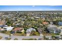 Wide angle view of a quiet residential neighborhood with a mix of single-Gathering homes and mature trees at 4504 Dewey Dr, New Port Richey, FL 34652