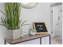 Inviting hallway decor featuring a potted plant and welcome sign, enhancing the home's appeal with a warm touch at 4607 Kennedy Dr, New Port Richey, FL 34652