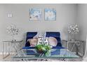 Cozy living room features stylish decor, modern lamps, and plush seating at 4607 Kennedy Dr, New Port Richey, FL 34652