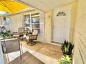 Inviting front porch with comfortable seating, perfect for enjoying the outdoors at 5128 Perennial Dr, Holiday, FL 34690