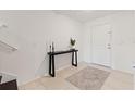 Welcoming home foyer showcasing ceramic tile flooring and a decorative console table at 5383 Companion Ln, Tampa, FL 33619